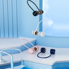 Colorful wireless earbuds on a blue poolside background